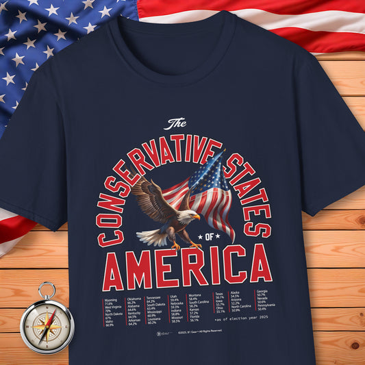 Navy blue t-shirt with 'The Conservative States of America' design featuring an eagle and American flag on a wooden surface with an American flag in the background.
